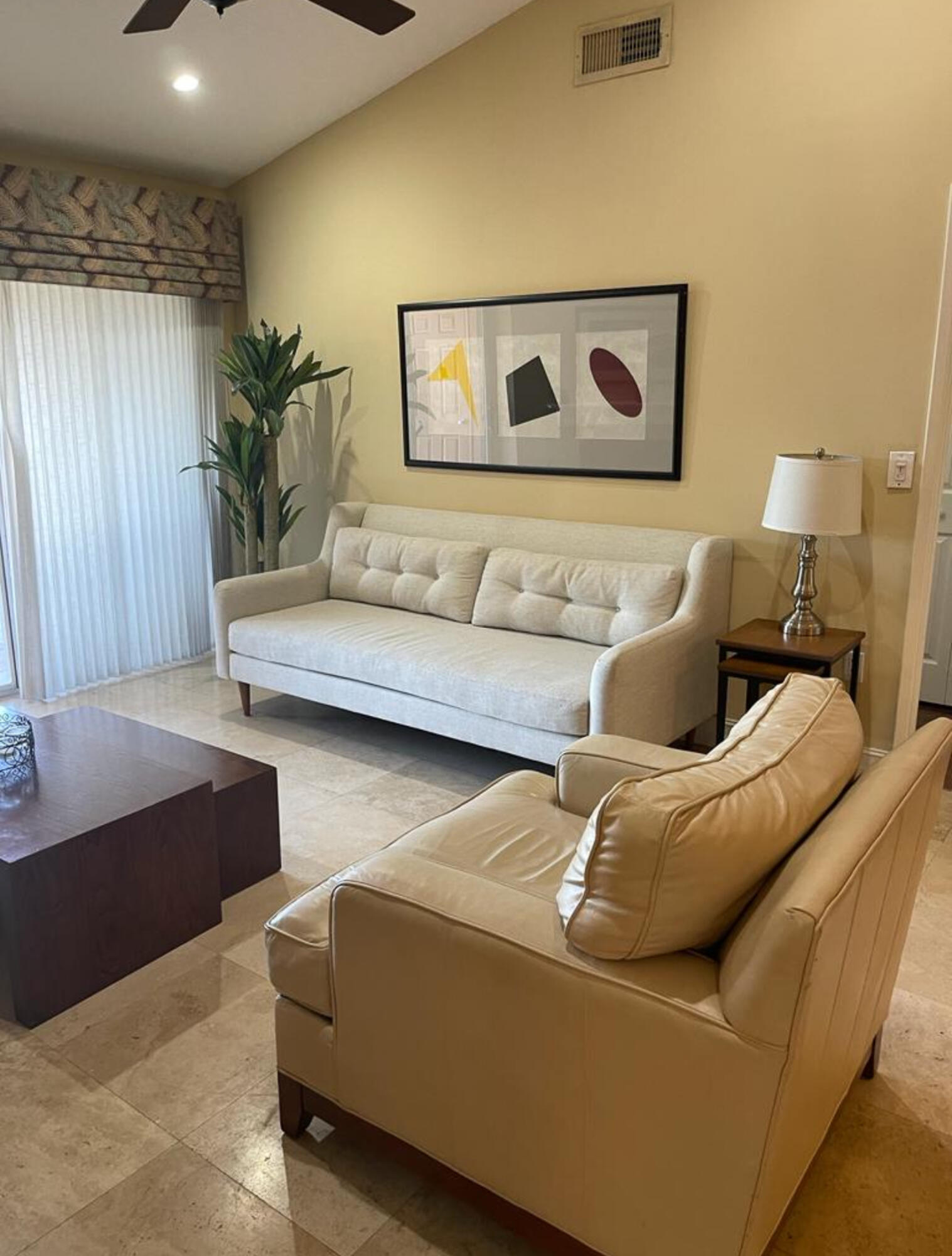 3111 Clint Moore Road, Unit 205 Boca Raton, FL 33496 - Photo 24 of 35 a living room with furniture and a couch