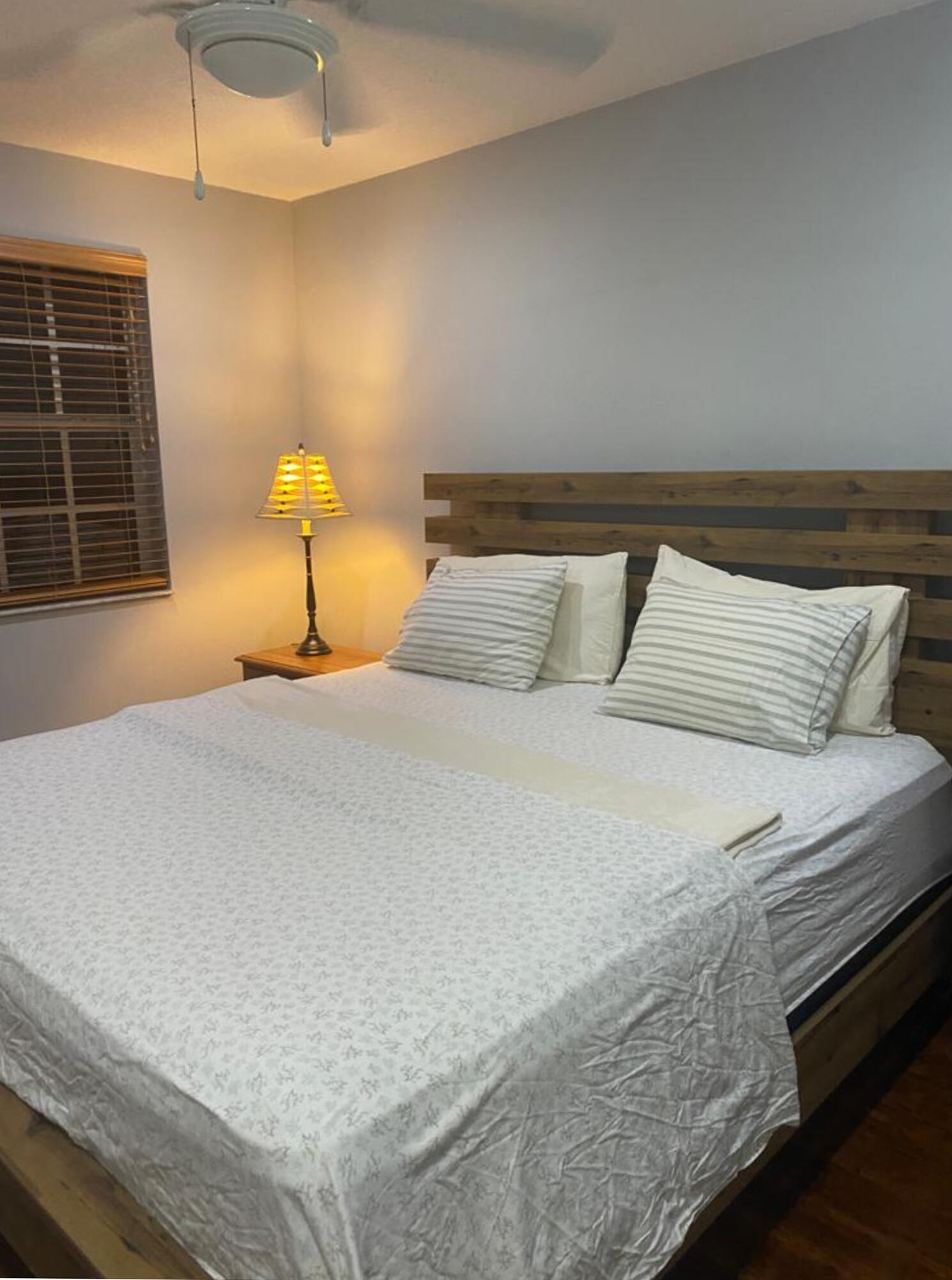 3111 Clint Moore Road, Unit 205 Boca Raton, FL 33496 - Photo 26 of 35 a bedroom with a bed and a window