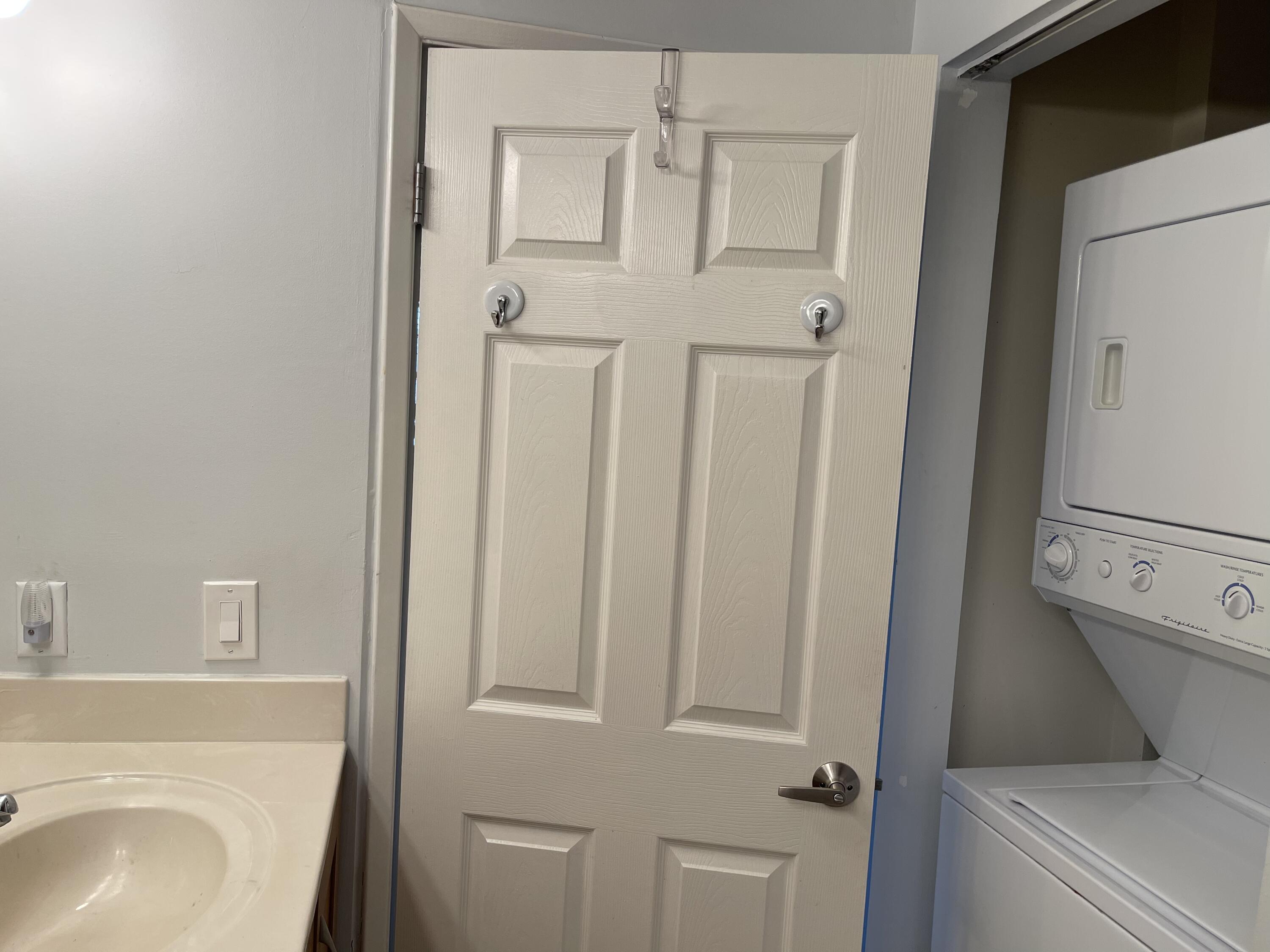 3111 Clint Moore Road, Unit 205 Boca Raton, FL 33496 - Photo 27 of 35 a bathroom with a sink a toilet and shower