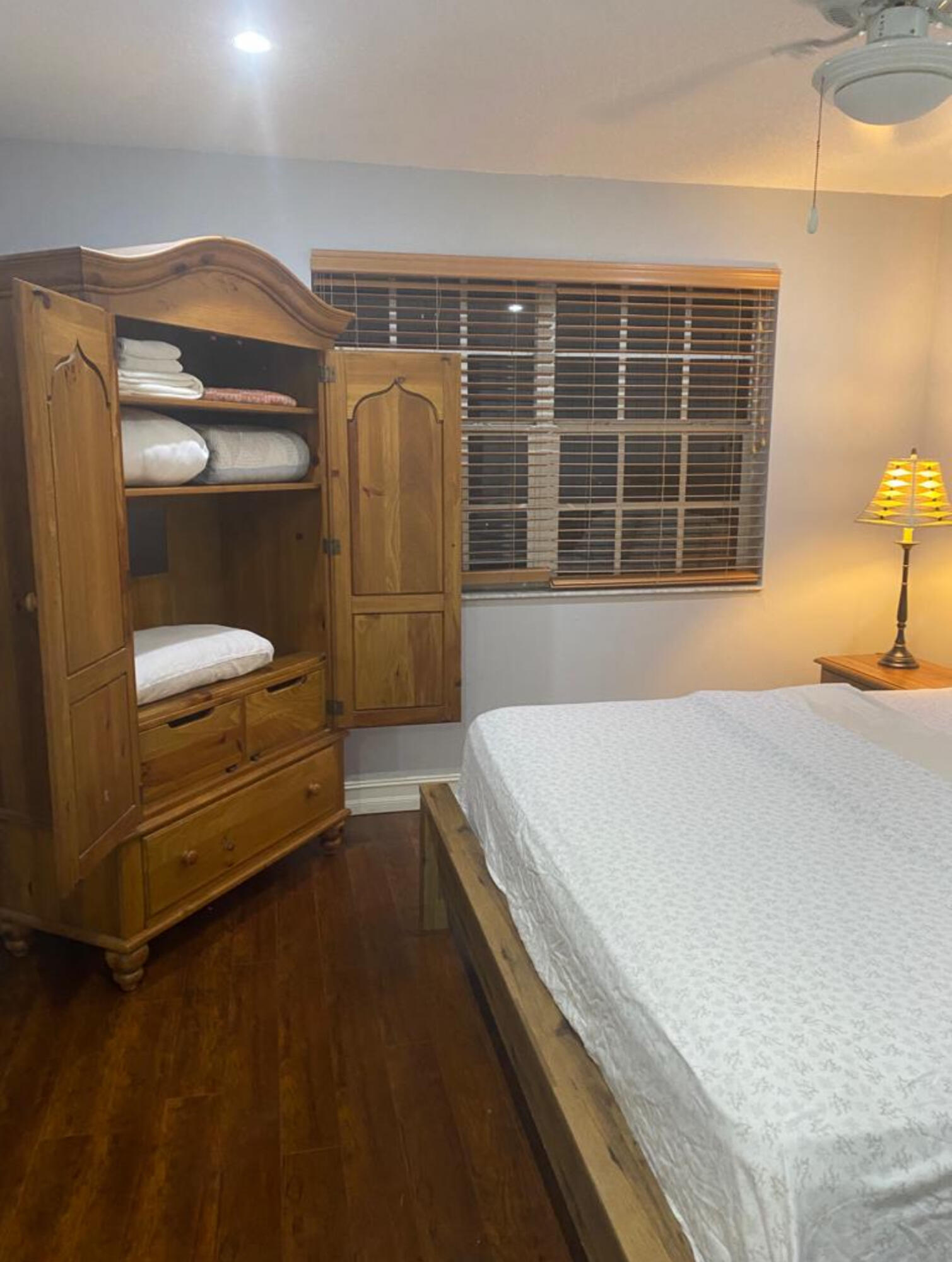 3111 Clint Moore Road, Unit 205 Boca Raton, FL 33496 - Photo 28 of 35 a bedroom with a bed and a window