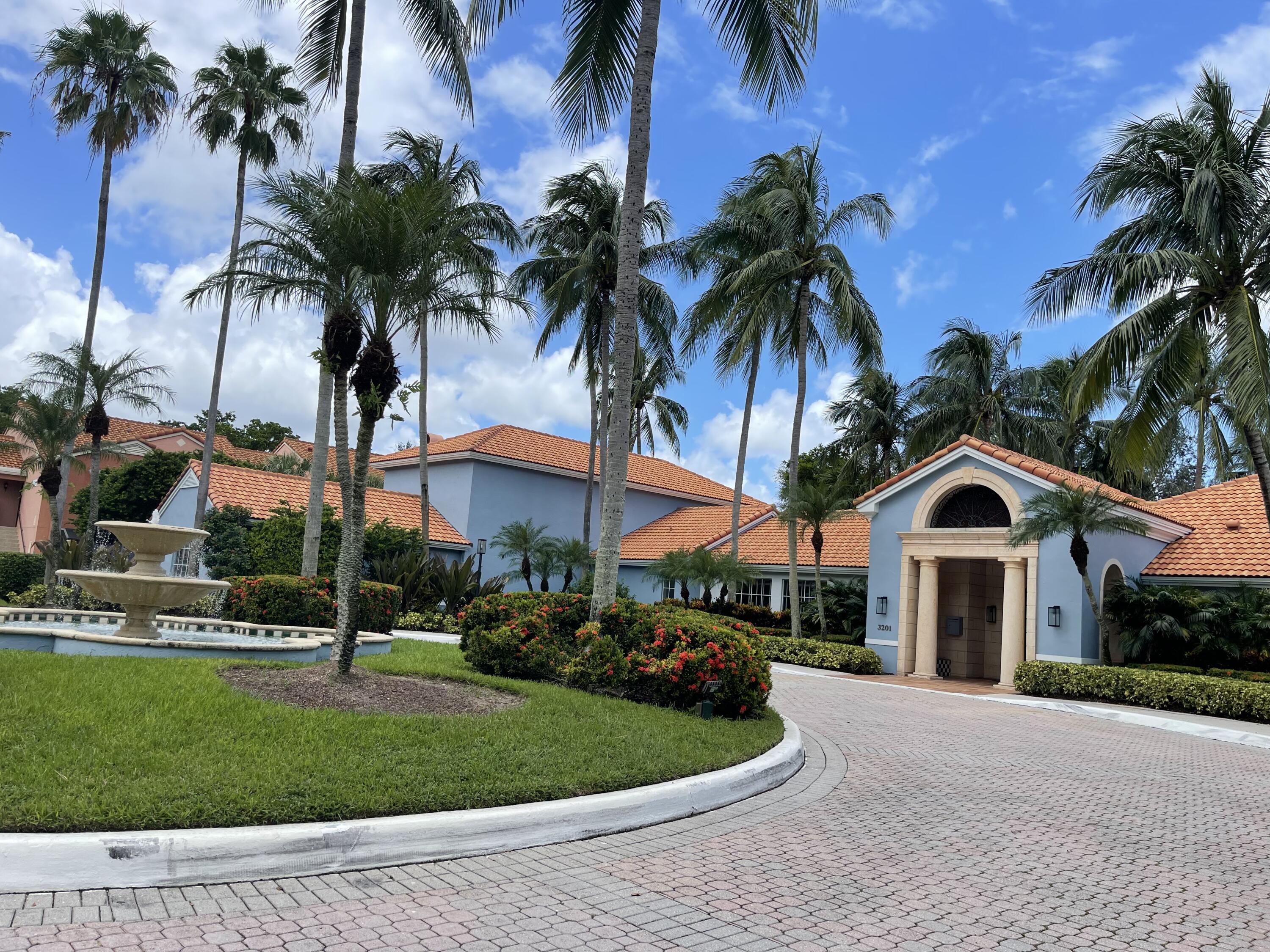 3111 Clint Moore Road, Unit 205 Boca Raton, FL 33496 - Photo 10 of 35 a front view of house with yard and green space