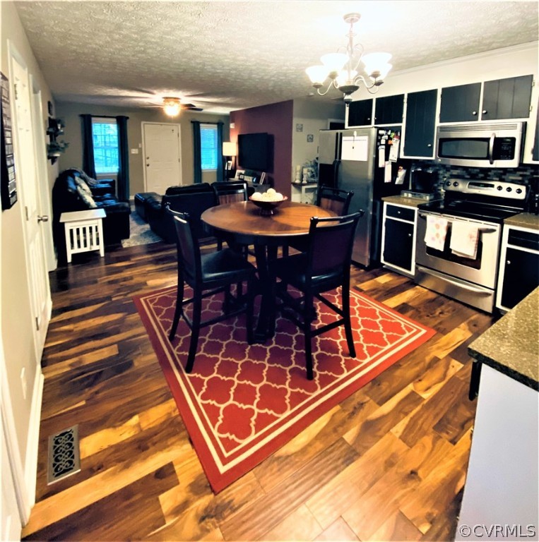 19600 Trumpeter Road Petersburg, VA 23803 - Photo 18 of 33 a dining room with a table and chairs