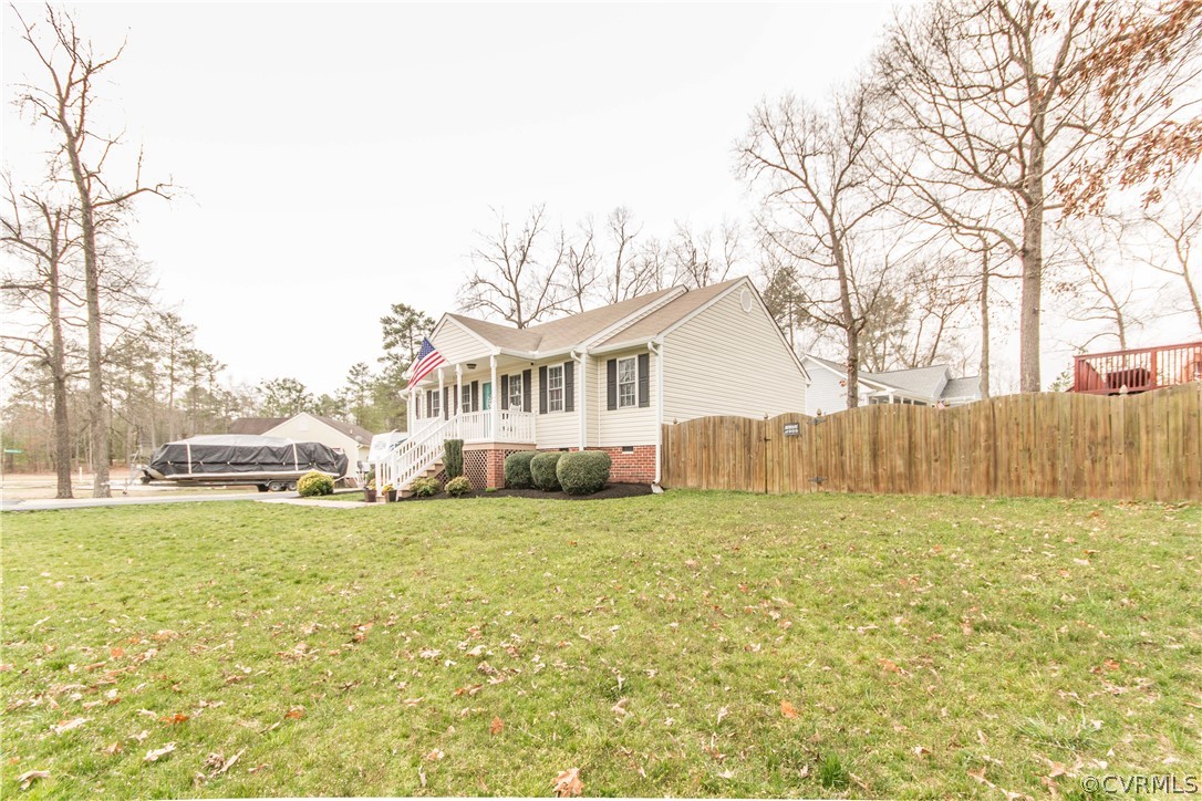 19600 Trumpeter Road Petersburg, VA 23803 - Photo 2 of 33 a view of a house with a yard and garage