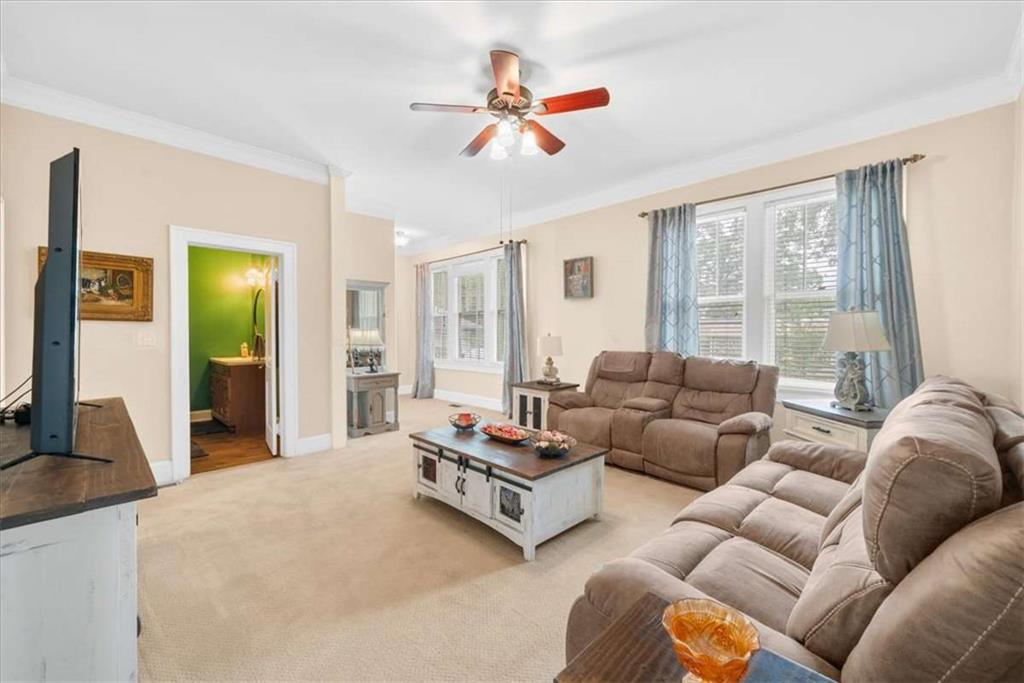 106 Westmore Road Southwest Rome, GA 30165 - Photo 27 of 56 a living room with furniture ceiling fan and a large window