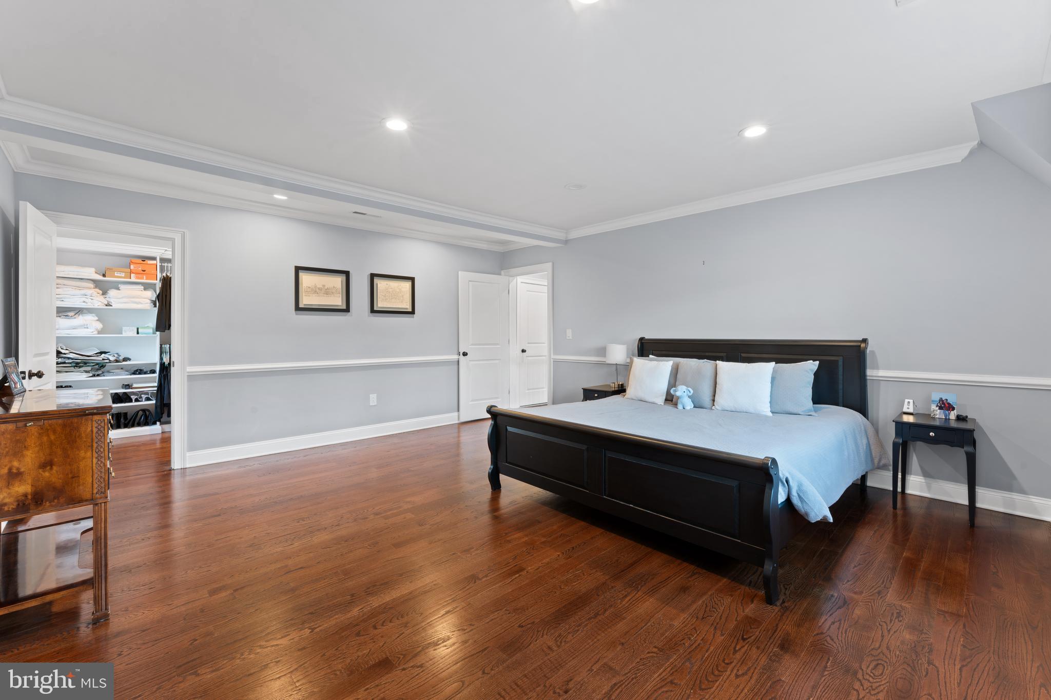 334 Fairhill Road Wynnewood, PA 19096 - Photo 21 of 45 a spacious bedroom with a bed and wooden floor
