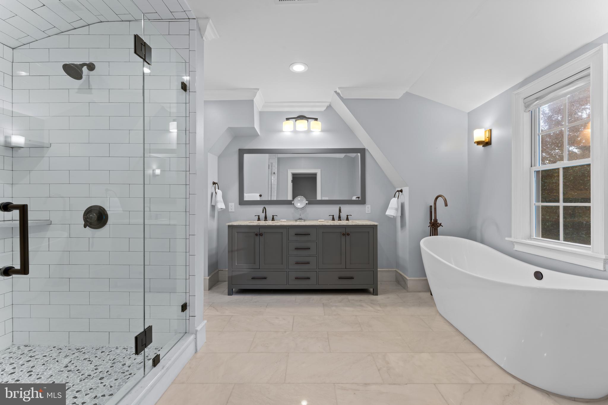 334 Fairhill Road Wynnewood, PA 19096 - Photo 22 of 45 a bathroom with a tub a sink a mirror and shower