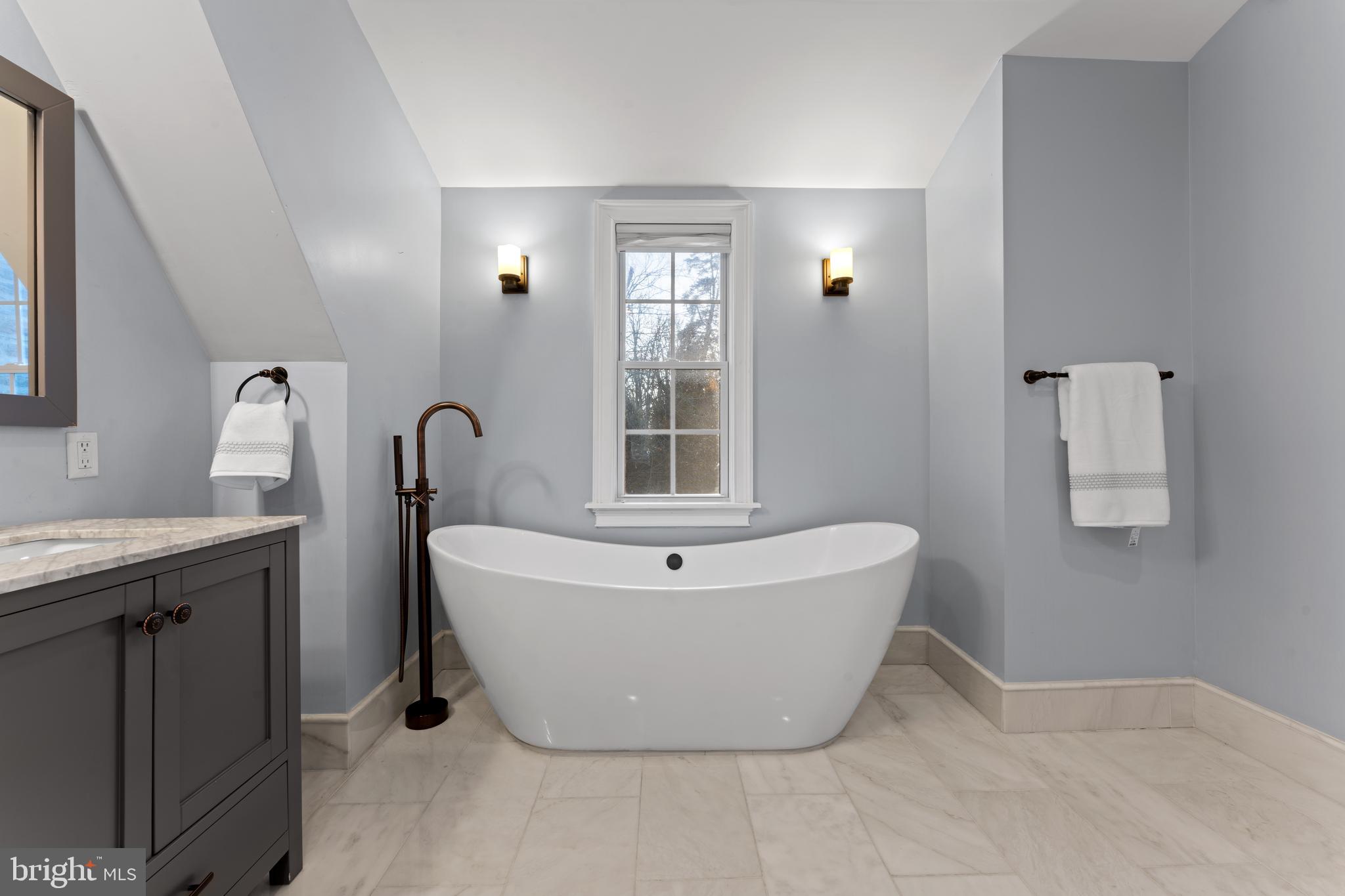 334 Fairhill Road Wynnewood, PA 19096 - Photo 23 of 45 a bath room with a sink and mirror