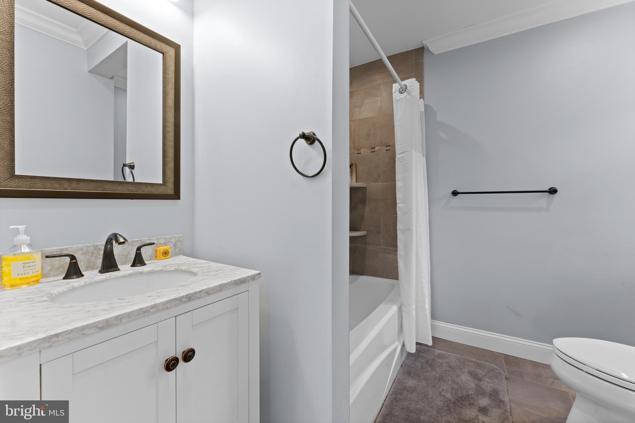 334 Fairhill Road Wynnewood, PA 19096 - Photo 32 of 45 a bathroom with a sink a toilet and shower