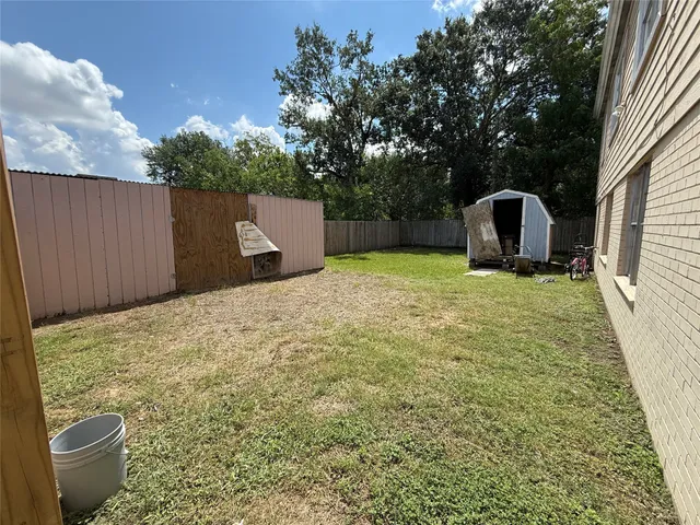 a backyard of a house with yard and entertaining space