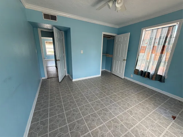 a view of an empty room and window