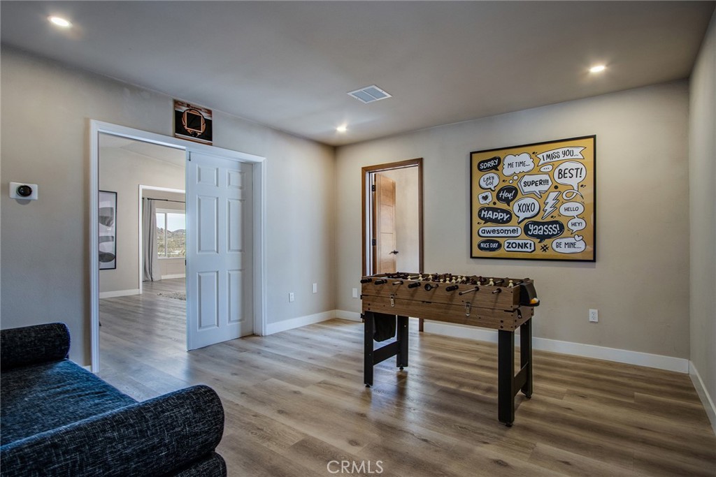9073 Tortuga Trail Joshua Tree, CA 92252 - Photo 14 of 39 a view of a livingroom with furniture and wooden floor