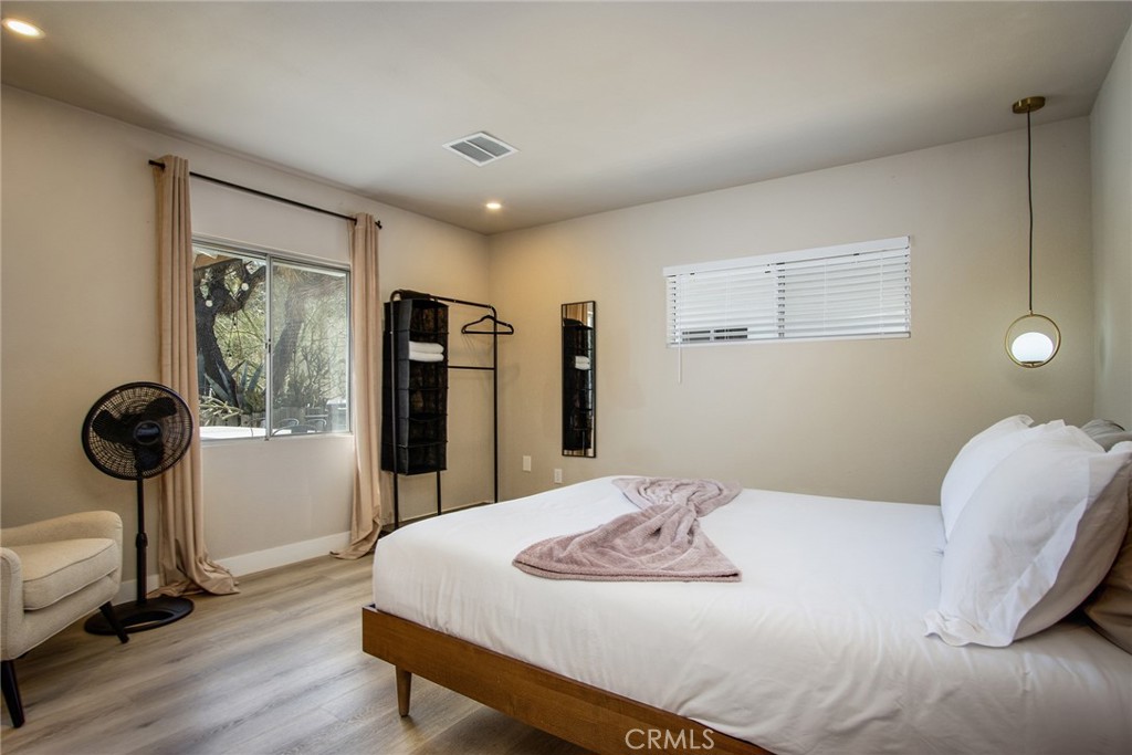 9073 Tortuga Trail Joshua Tree, CA 92252 - Photo 15 of 39 a bedroom with a bed and a table