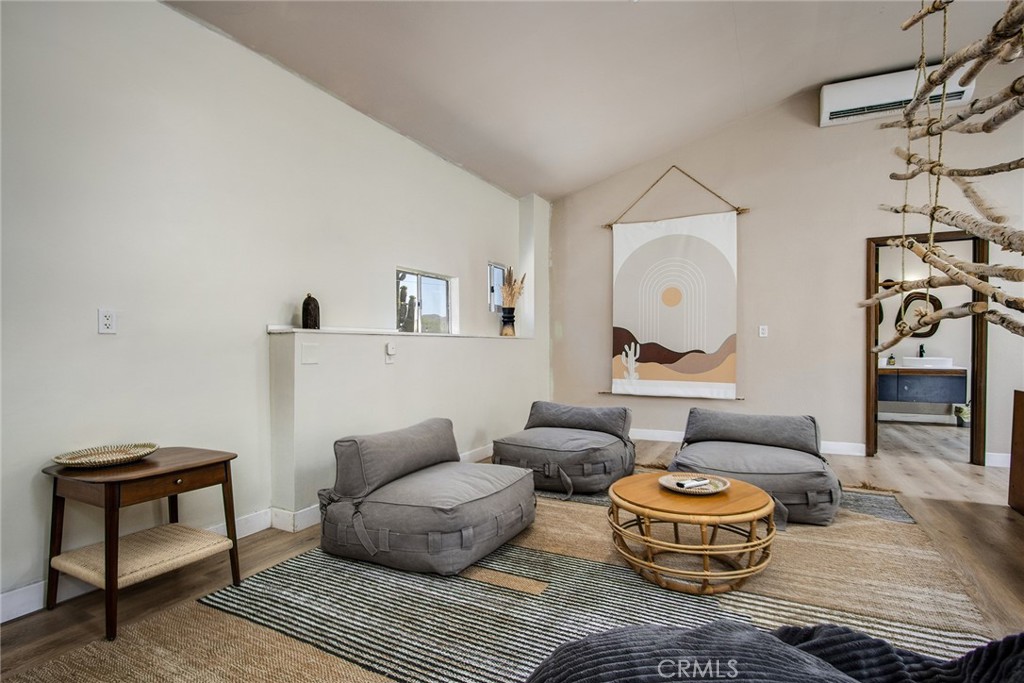 9073 Tortuga Trail Joshua Tree, CA 92252 - Photo 29 of 39 a living room with furniture and a potted plant