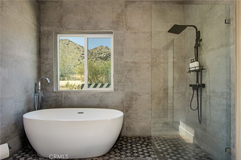 9073 Tortuga Trail Joshua Tree, CA 92252 - Photo 33 of 39 a bathroom with a bathtub and shower