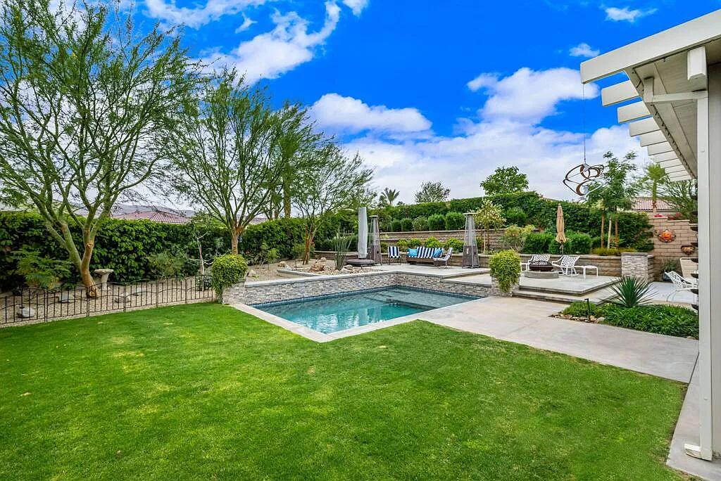 a view of a swimming pool with a patio