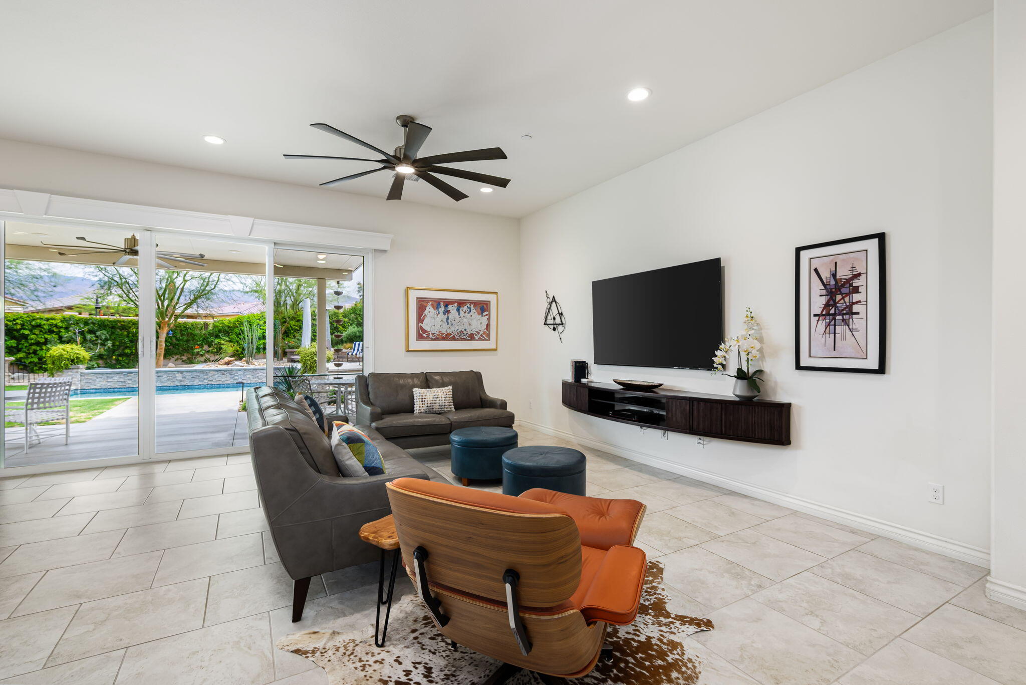 85568 Brovello Drive Indio, CA 92203 - Photo 15 of 50 a living room with furniture a flat screen tv and a large window