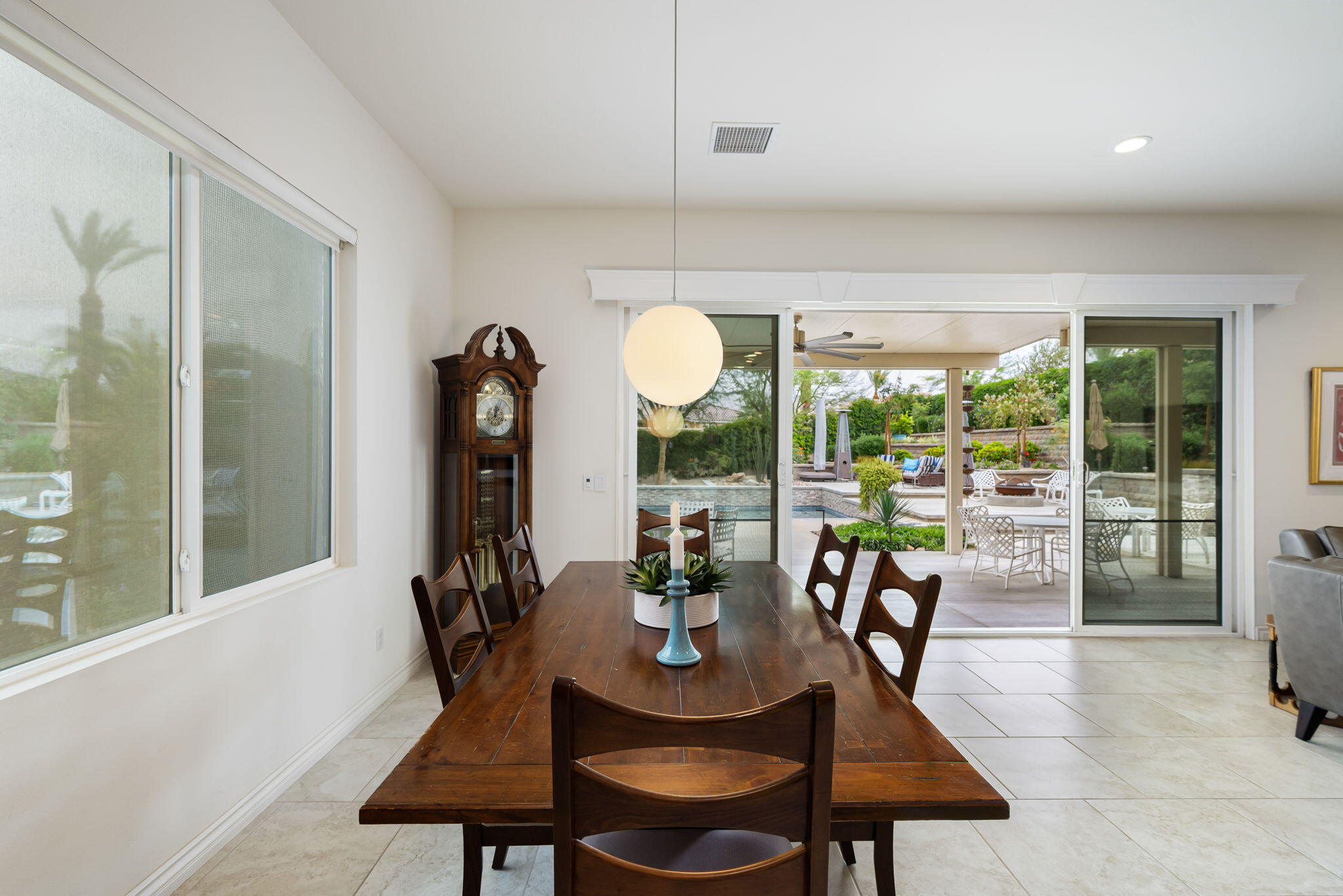 85568 Brovello Drive Indio, CA 92203 - Photo 21 of 50 a dining room with furniture a chandelier and window