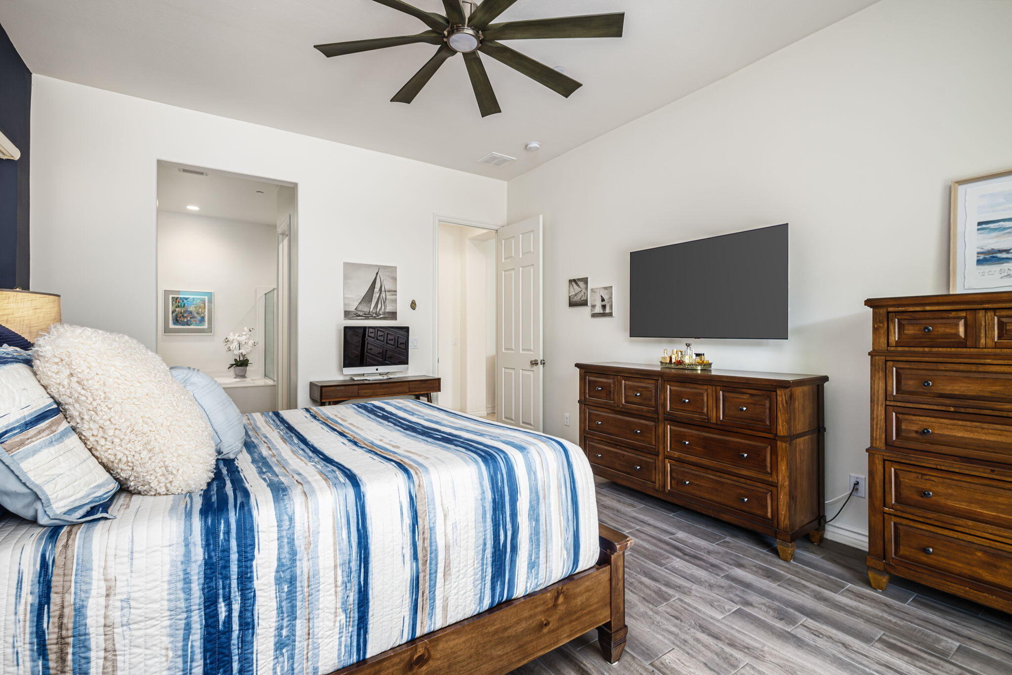 85568 Brovello Drive Indio, CA 92203 - Photo 23 of 50 a bedroom with a bed and flat screen tv