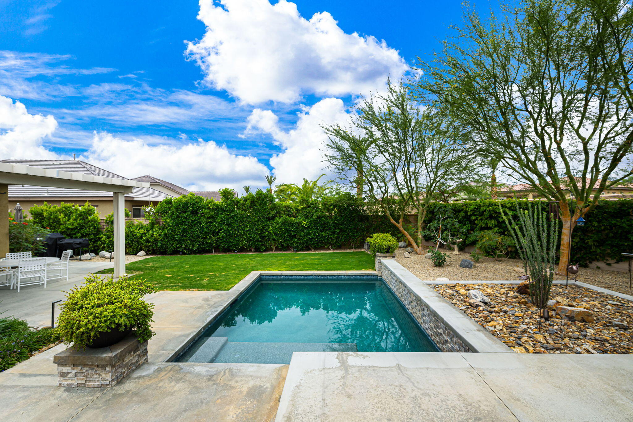 85568 Brovello Drive Indio, CA 92203 - Photo 34 of 50 a view of a backyard with swimming pool