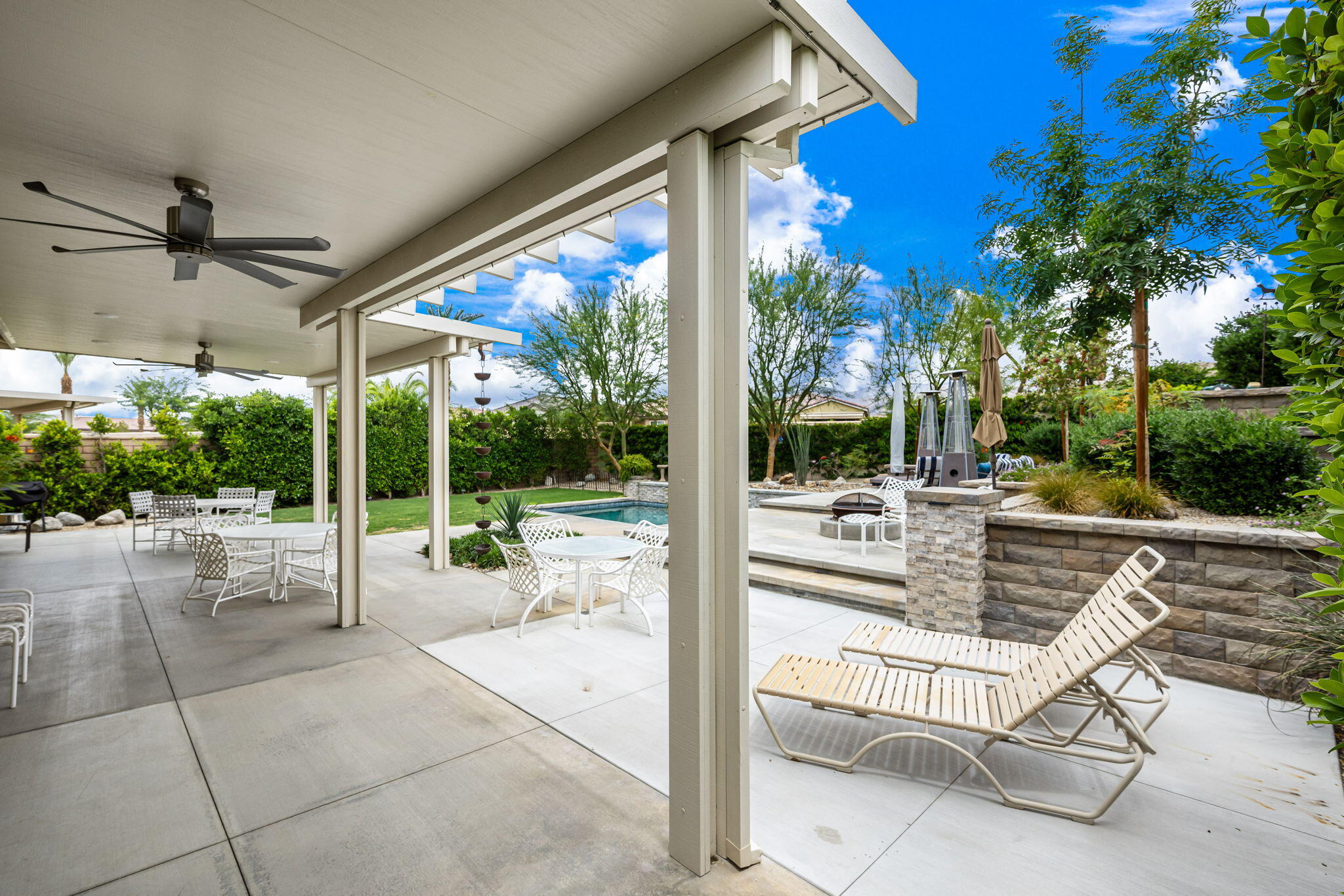85568 Brovello Drive Indio, CA 92203 - Photo 37 of 50 a view of a patio with a table and chairs