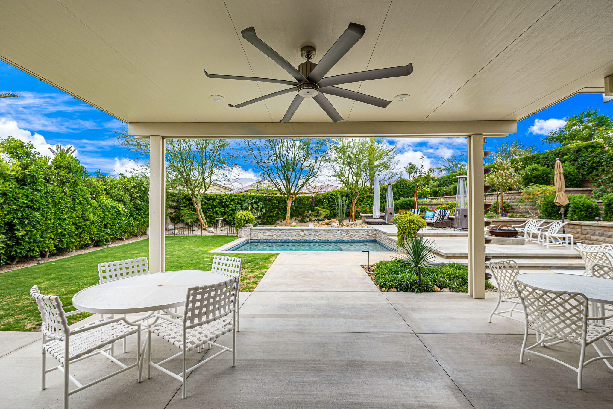 85568 Brovello Drive Indio, CA 92203 - Photo 44 of 50 a view of a patio with a table and chairs