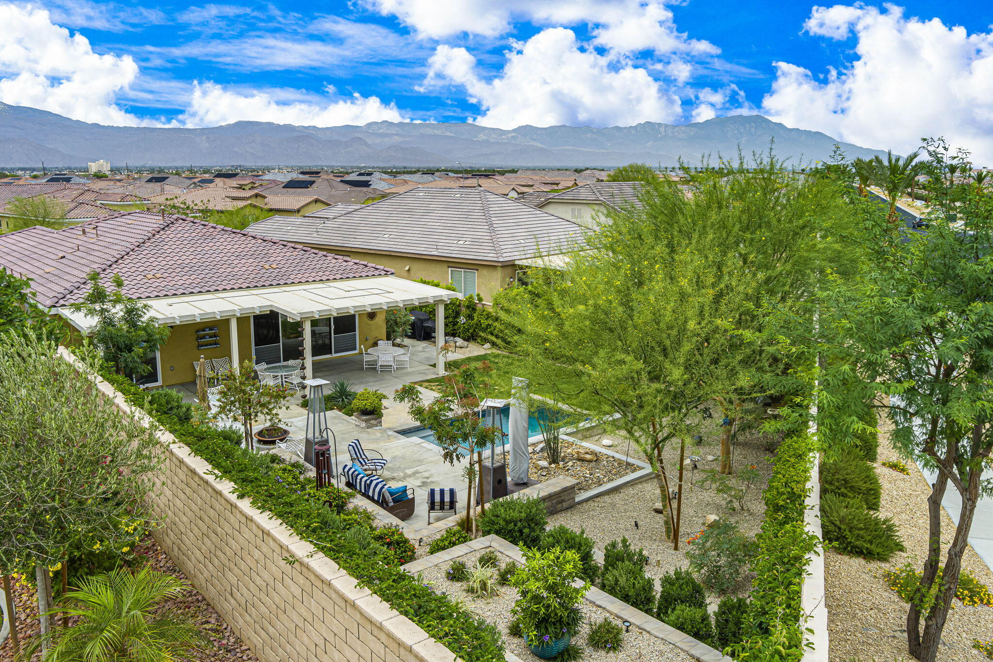 85568 Brovello Drive Indio, CA 92203 - Photo 48 of 50 a front view of a house with a garden
