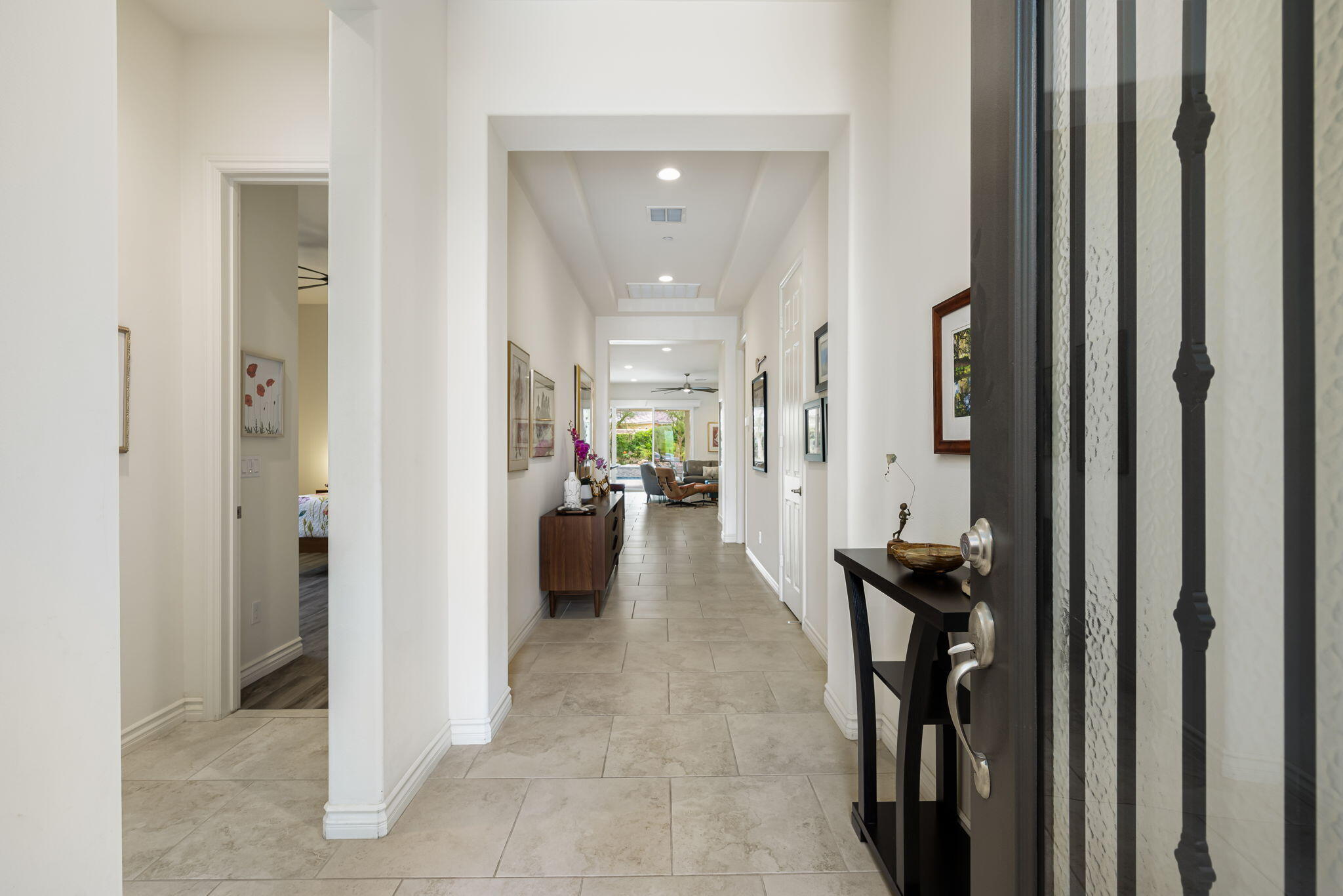 85568 Brovello Drive Indio, CA 92203 - Photo 5 of 50 a view of a hallway with a livingroom and a bathroom
