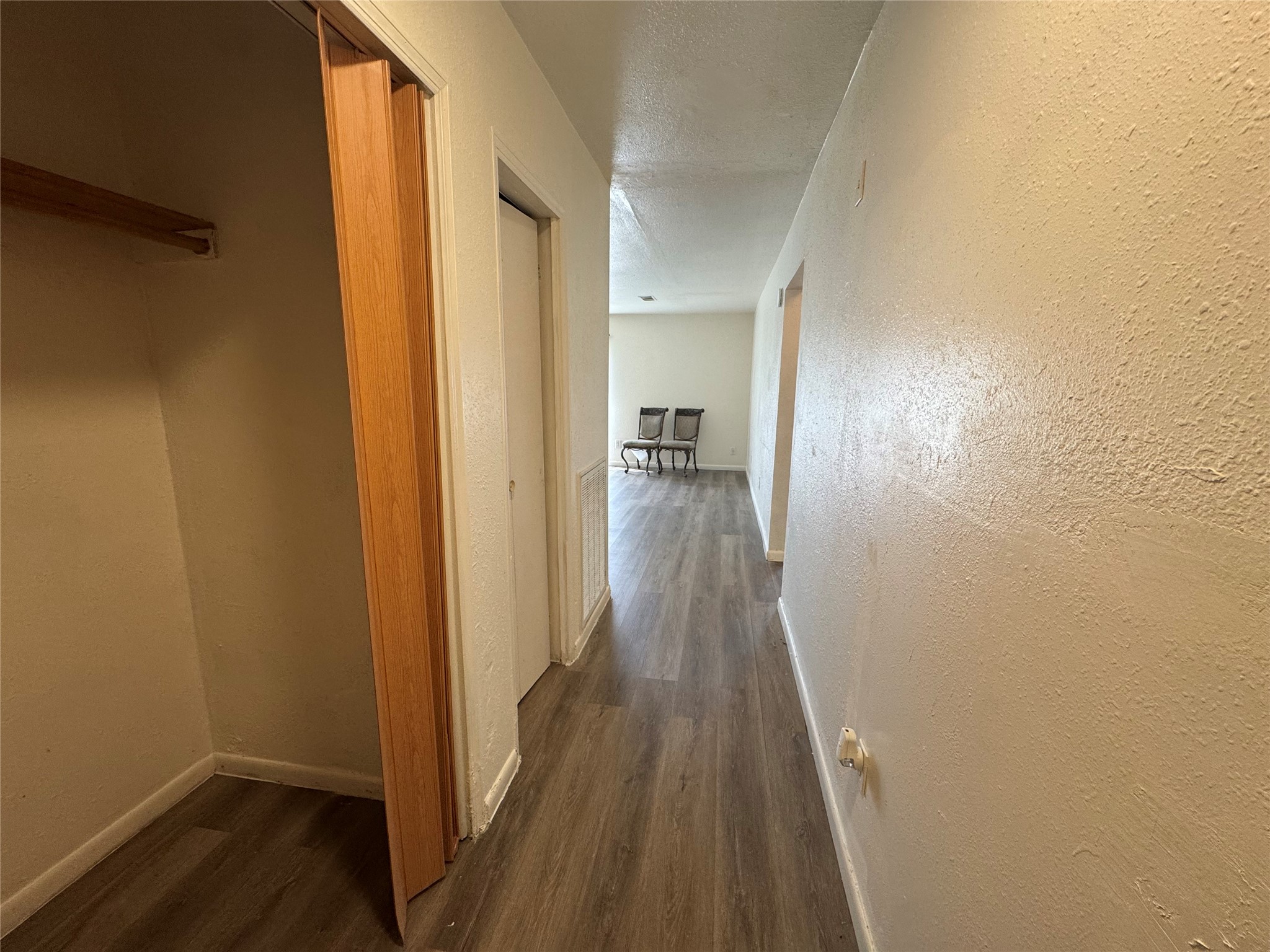 733 Pine Avenue Prairie View, TX 77445 - Photo 5 of 17 a view of a hallway with wooden floor
