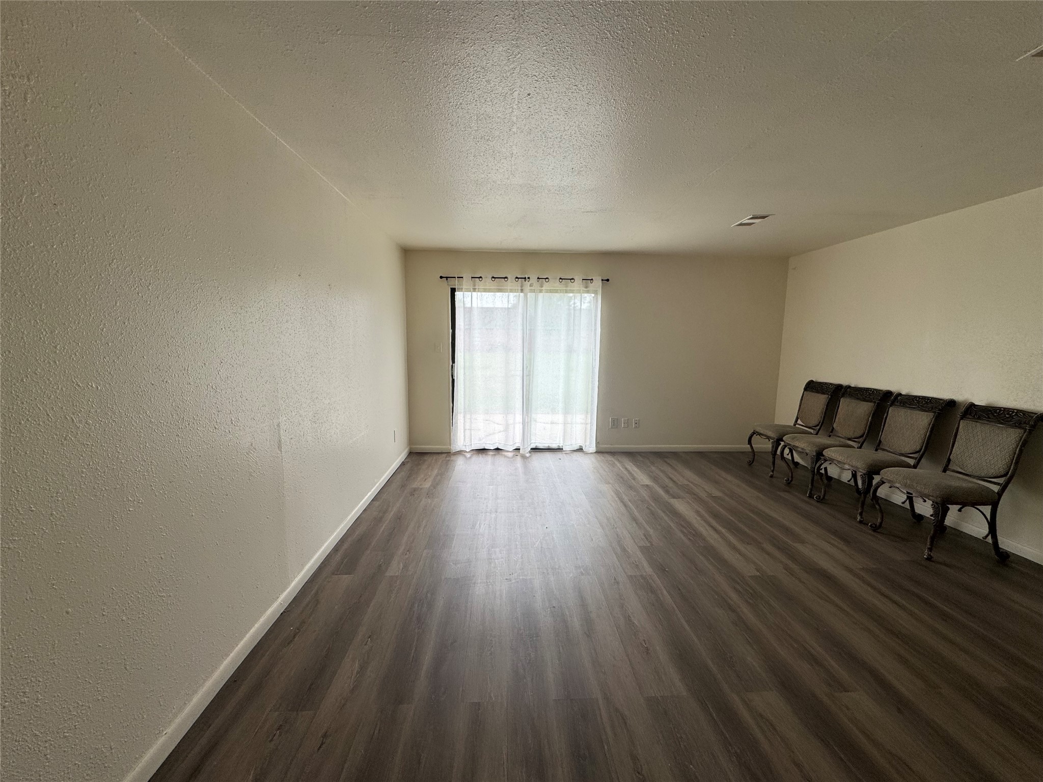 733 Pine Avenue Prairie View, TX 77445 - Photo 6 of 17 a view of a room with wooden floor and furniture