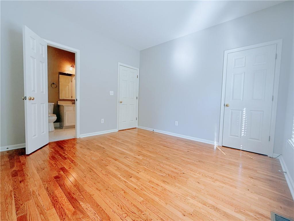 3332 Drawbridge Terrace Duluth, GA 30096 - Photo 13 of 28 a view of empty room with wooden floor