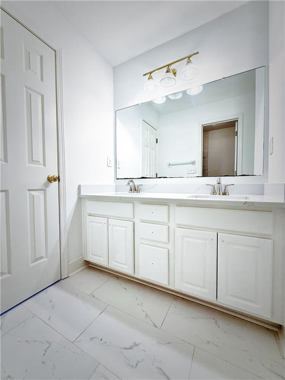 3332 Drawbridge Terrace Duluth, GA 30096 - Photo 24 of 28 a spacious bathroom with a sink and a mirror