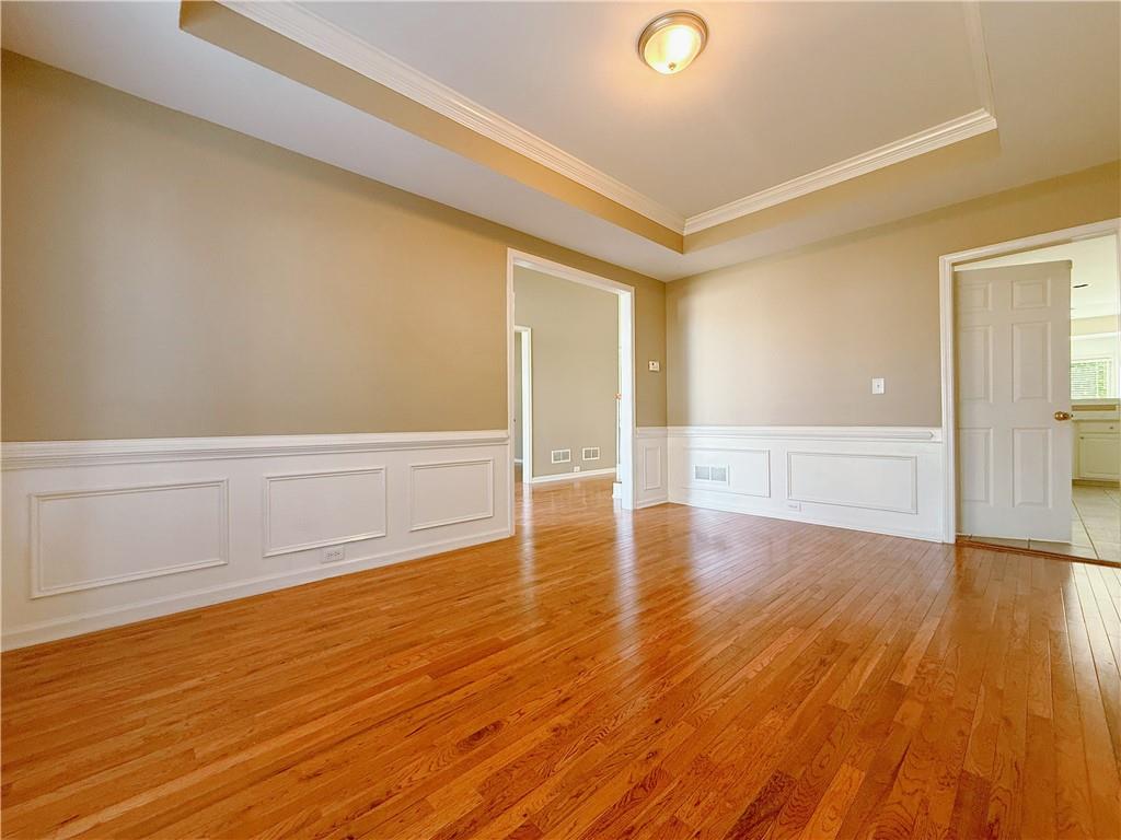 3332 Drawbridge Terrace Duluth, GA 30096 - Photo 3 of 28 a view of an empty room with wooden floor
