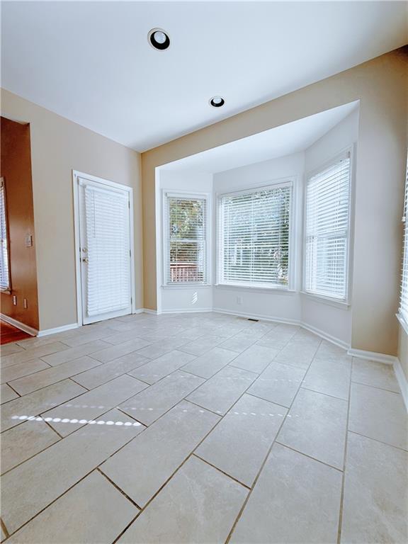 3332 Drawbridge Terrace Duluth, GA 30096 - Photo 7 of 28 a view of an empty room with a window