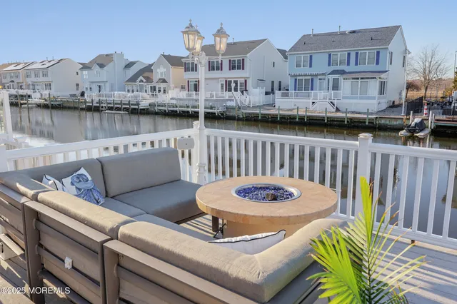 a view of a deck with table and chairs