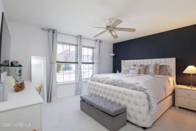 a living room with furniture and a dining table