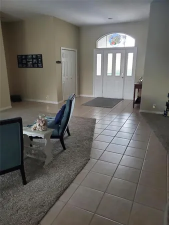 a view of a livingroom with furniture and windows