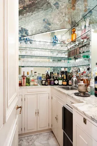 a kitchen with stainless steel appliances granite countertop a refrigerator and a stove