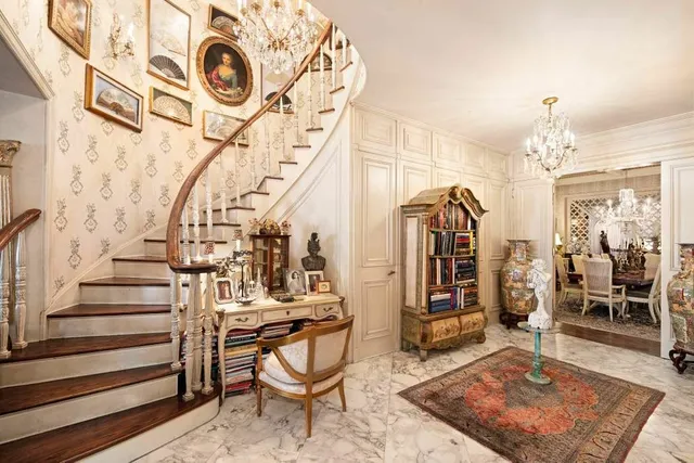 a view of a hallway with wooden door