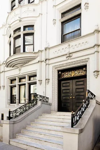 a kitchen with a stove and a white cabinets