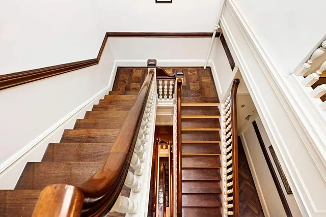 a living room with furniture and a lamp