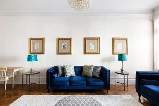 a view of a garden with a chair and flower garden