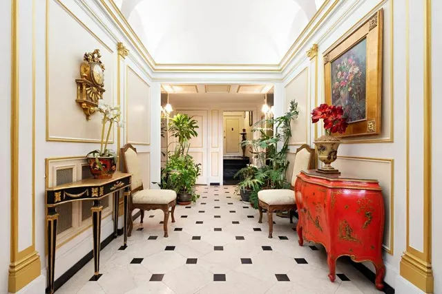 a bathroom with a sink mirror and toilet