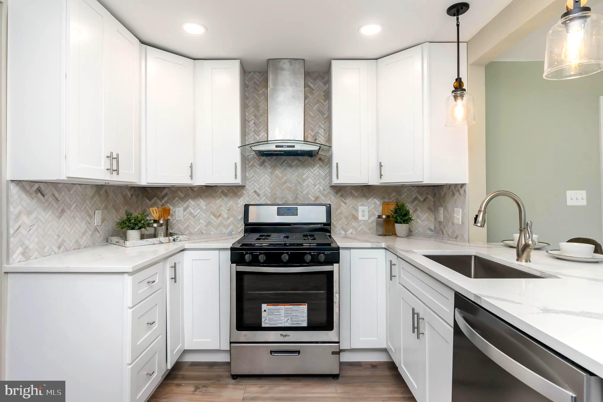 9120 Orbitan Road Parkville, MD 21234 - Photo 5 of 30 Herringbone backplash, stylish exhaust hood