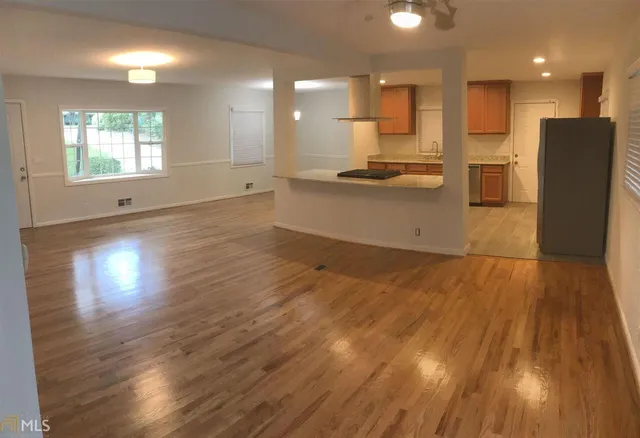 a view of kitchen and wooden floor