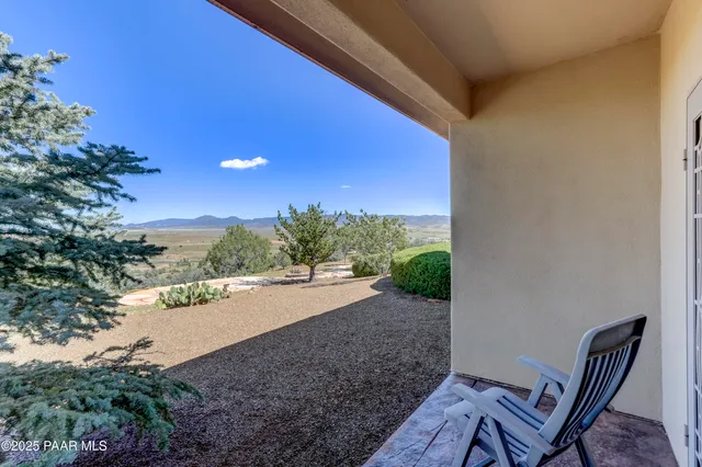 a spacious bathroom with a tub sink and mirror