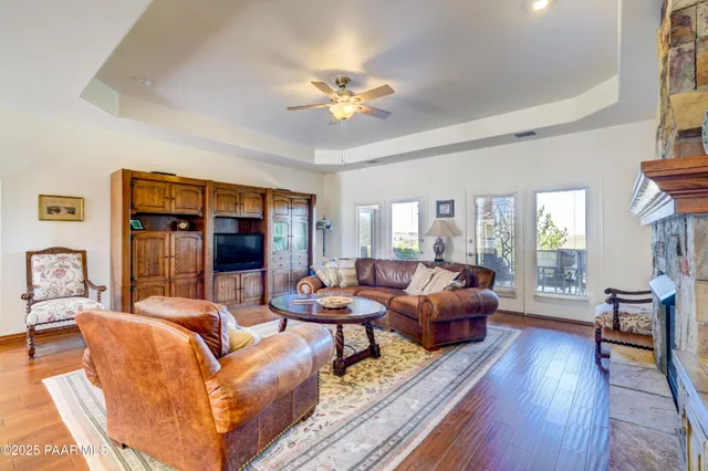 a living room with fireplace furniture and a fireplace