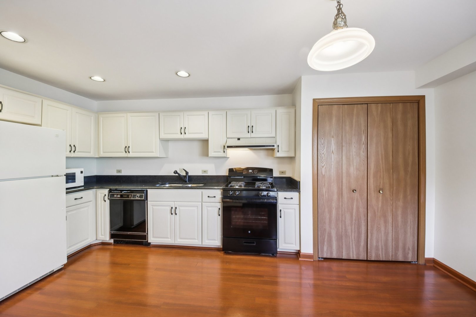 37 Terrace Lane, Unit F Lake Zurich, IL 60047 - Photo 16 of 40 a kitchen with stainless steel appliances granite countertop a stove and a refrigerator