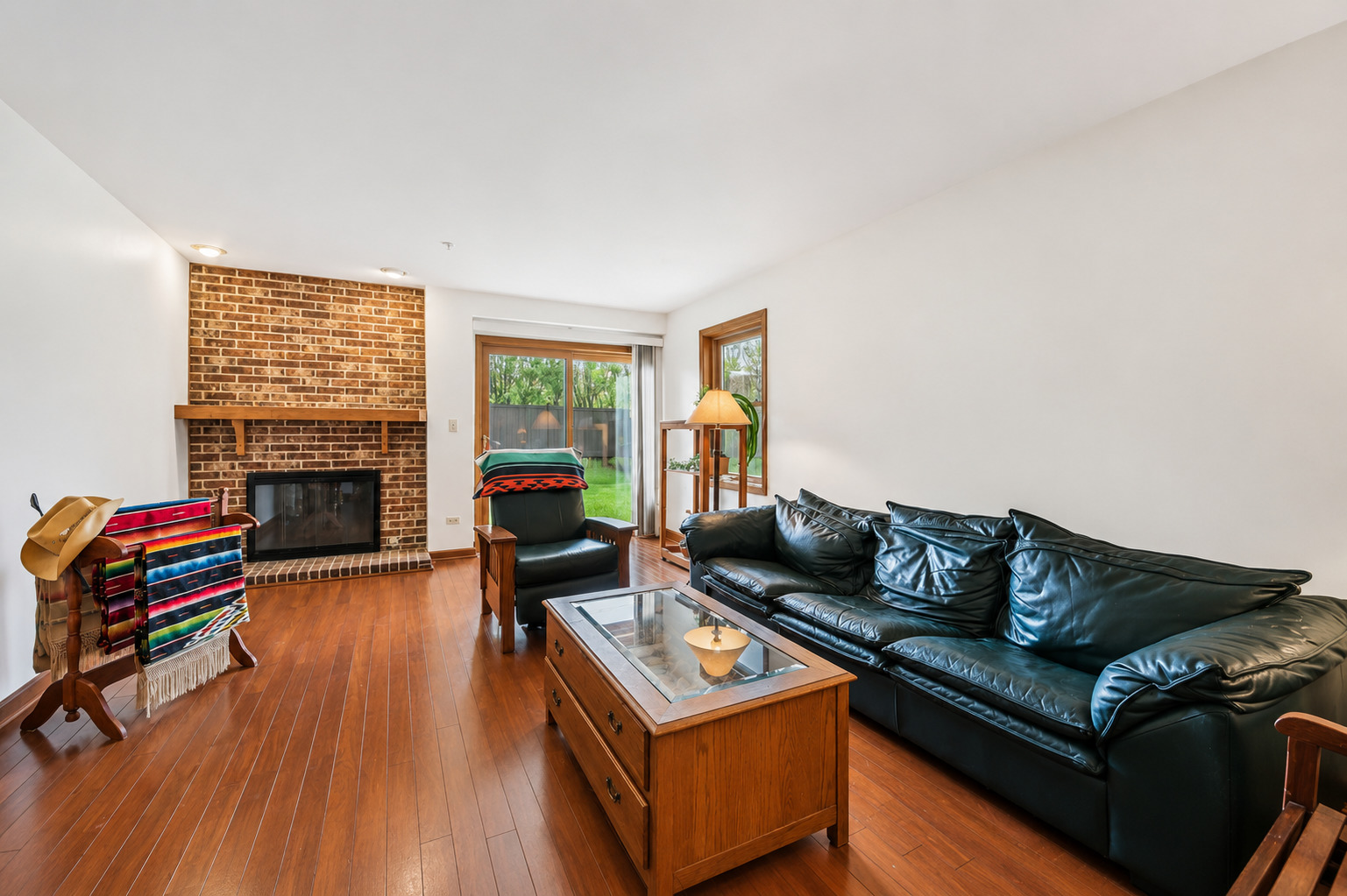37 Terrace Lane, Unit F Lake Zurich, IL 60047 - Photo 5 of 40 a living room with furniture and a fireplace