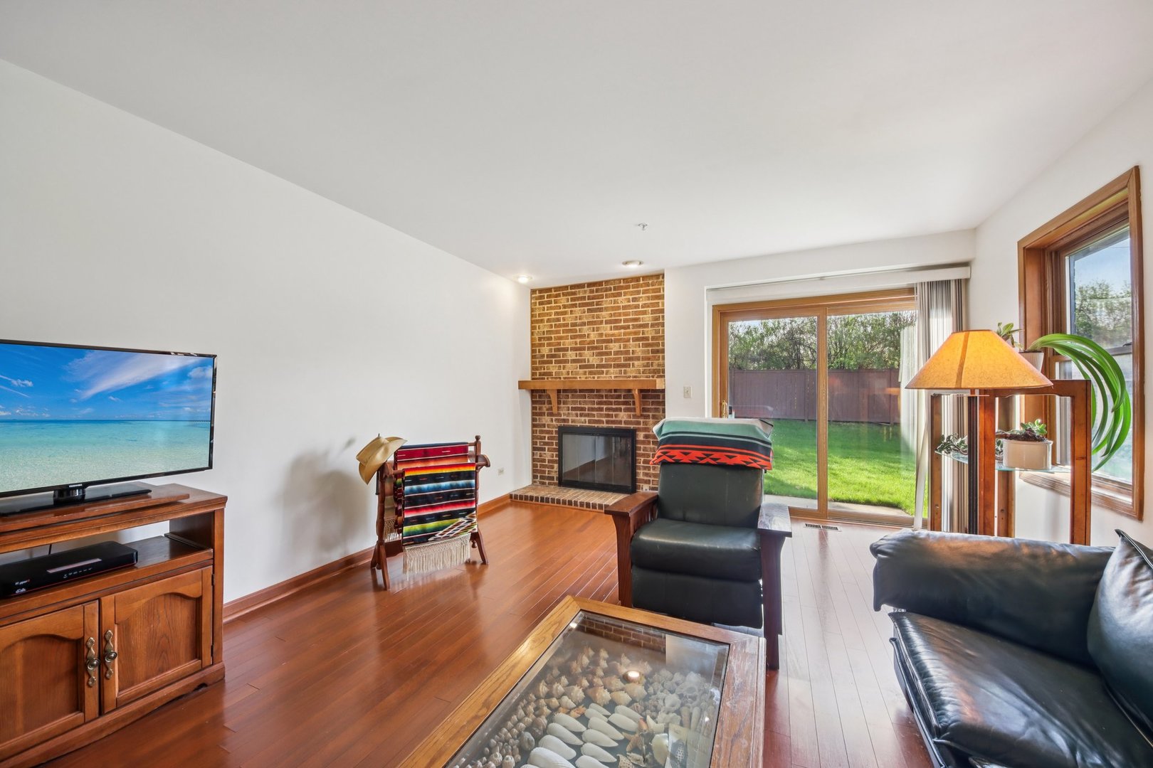 37 Terrace Lane, Unit F Lake Zurich, IL 60047 - Photo 7 of 40 a living room with furniture and a flat screen tv
