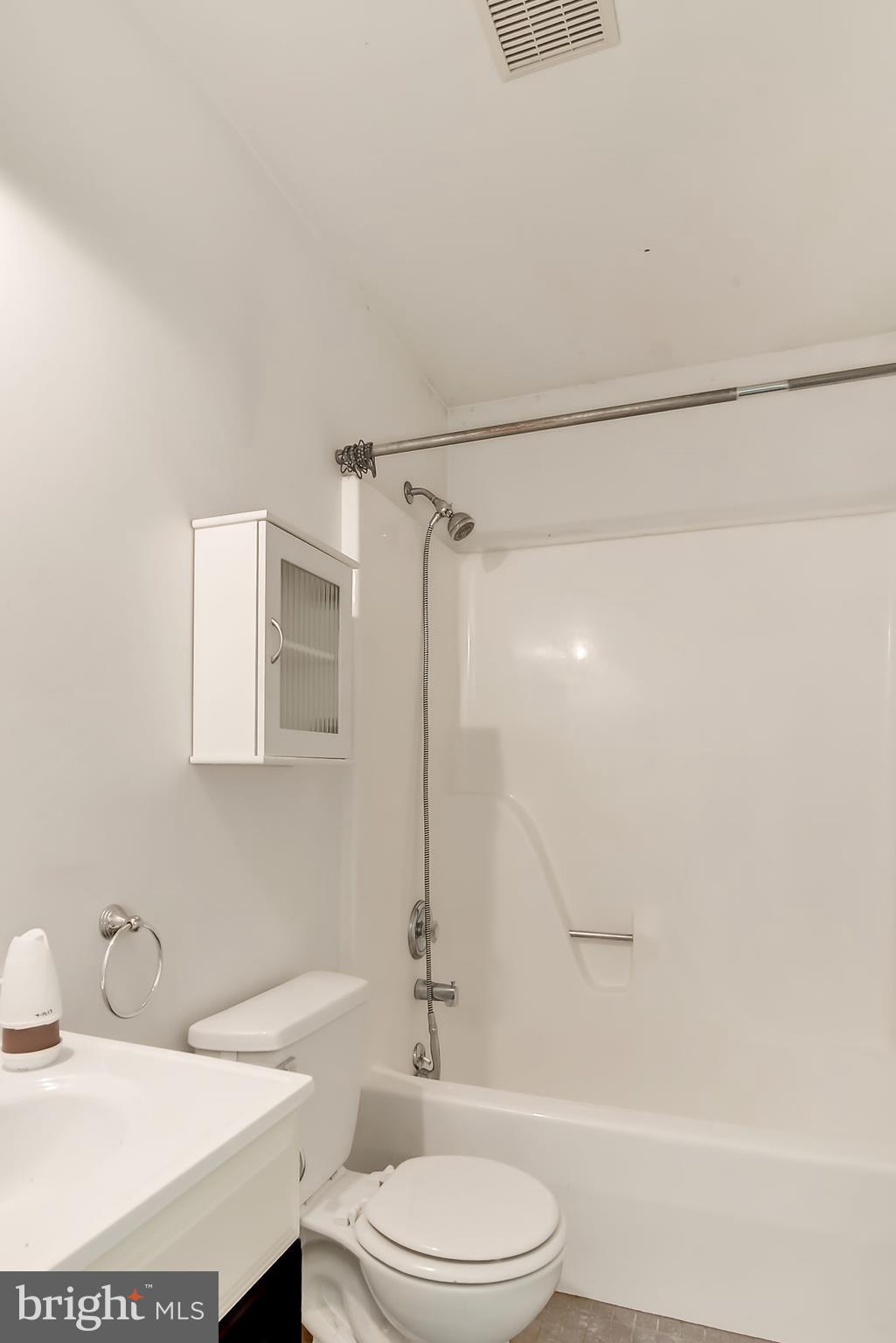1211 Hillside Road Pasadena, MD 21122 - Photo 19 of 24 a bathroom with a sink a toilet and shower